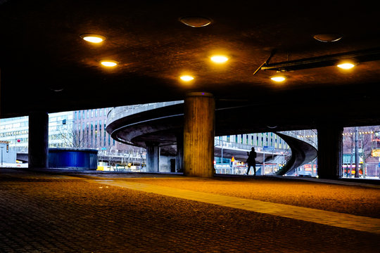 Stockholm, Sweden A pedestrian in an urban concrete landscape in downtown on Vasagatan.