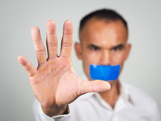 The man showing hand gesture stop sign isolated on white background.