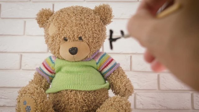 Abandoned toy. Child abuse concept. The bear cub asks for help.