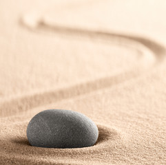Fototapeta na wymiar Zen meditation Japanese stone and sand garden with raked line. Concept for concentration and focus for purity, harmony and balance. Background with copy space. .