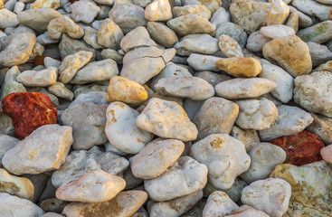 Sea stones background. The coast of England. Natural color combination.