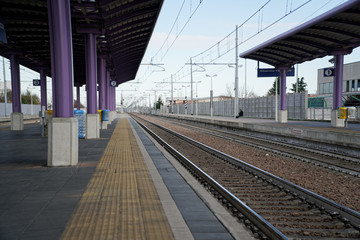 Empty train station, and deserted platform.