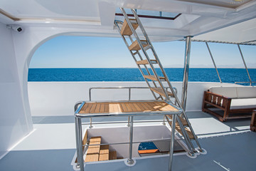 Steps on deck of a luxury motor yacht
