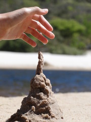 CHILD MAKING SAND CASTLE