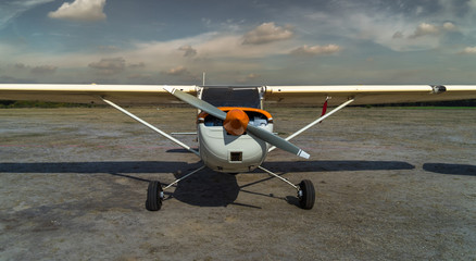 Front view of a historical small airplane after landing