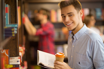 Handsome young male student at the library