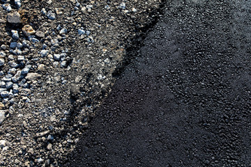 Stones on the edge of the asphalt road