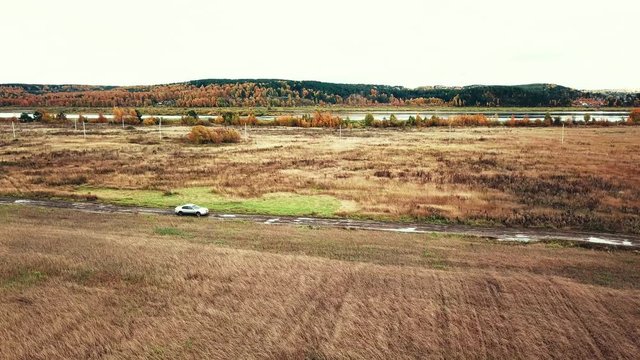 Car in the field goes off-road