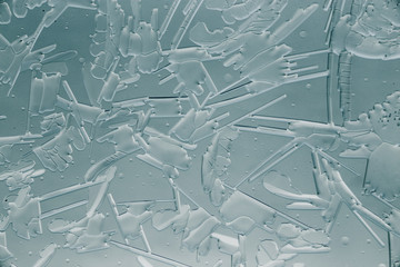 Snow patterns on glass as an abstract background