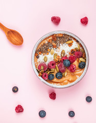 Delicious smoothie bowl with berries and dryed coconut.