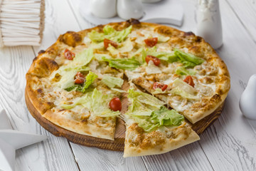 vegetarian pizza with tomatoes, cheese and salad