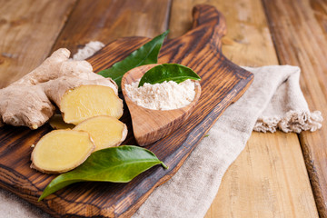 Ginger and lemon on a wooden background, Photo in a rustic style. Ingredients for warming and health drink. Alternative medicine. Free space for text.