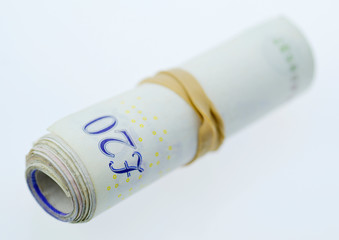 A Roll of Twenty Pound Notes held together with an Elastic Band