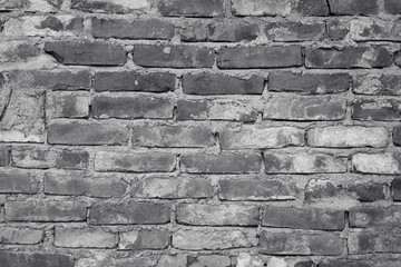Black and white brick. Old brick wall, old texture of red stone blocks closeup. Wall texture. Copy space.