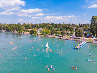 aerial view of lake with swimming people. summer time