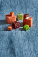 Meat cubes with leek on wooden board