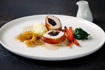 Chicken balmoral stuffed with black pudding, carrots, spinach and jerusalem artichokes