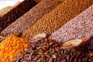Dried fruit and nuts on market stall at the bazaar in Marrakesh, Morocco