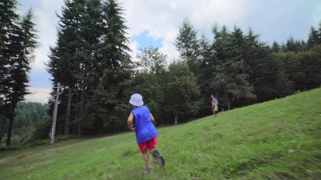 child running free in mountain meadow