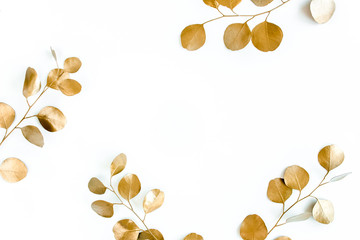 Borders of the frame of gold branches, eucalyptus leaves on a white background. flat layout, top view