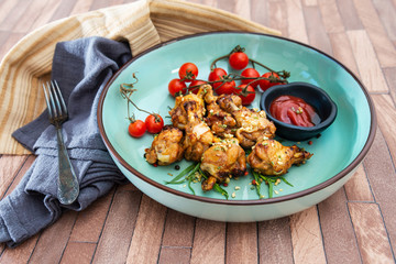 delicious fried chicken wings with sauce