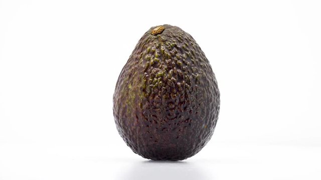 Whole Avocado Center Frame 
in 4k 3840 x 2160 Rotating, Looping, 360 Degree Rotation on White Background