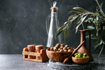 Green olives in wooden bowl