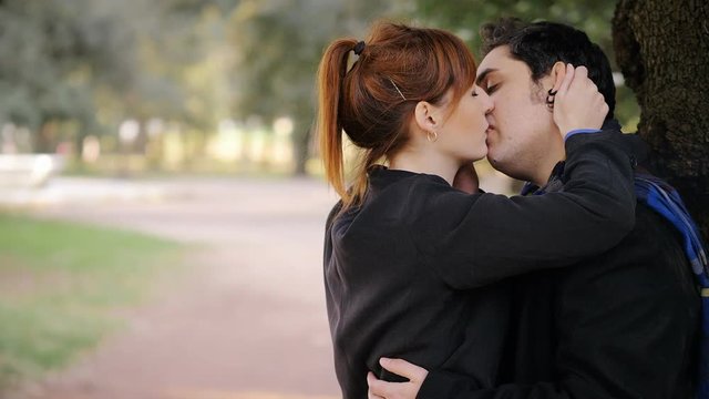 betrayal, infidelity. Young woman sees her boyfriend kissing another woman