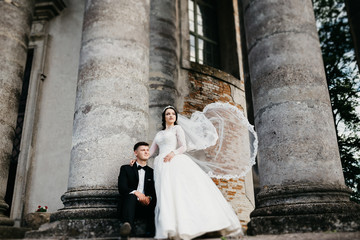 Amazing picture of a wedding couple near the old castle