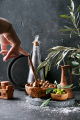 Green olives in wooden bowl