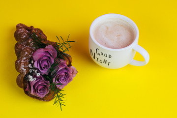 Coffee mug with yellow tulip flowers and chocolate good morning on yellow , breakfast on Mothers day or Womens day
