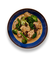 A blue bowl of succulent Thai Red Chicken Curry