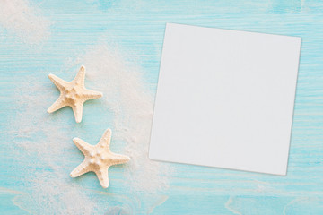 Fototapeta na wymiar Starfishes and white paper