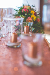 wedding table with floral arrangement prepared for reception, wedding, birthday or event centerpiece 