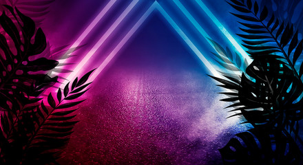 Empty scene background, abstract background with multicolored bokeh and neon lights. Silhouettes of tropical leaves