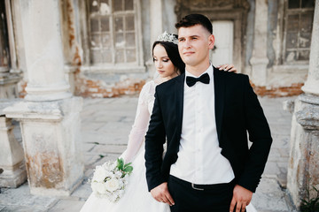 Amazing portrait of a wedding couple near the old castle