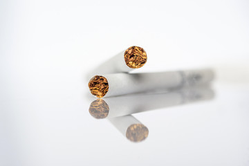 Cigarettes close up on a white background.