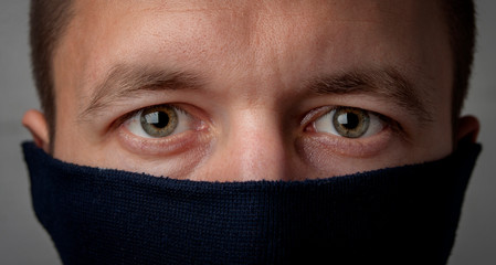 Man's face covered with a mask