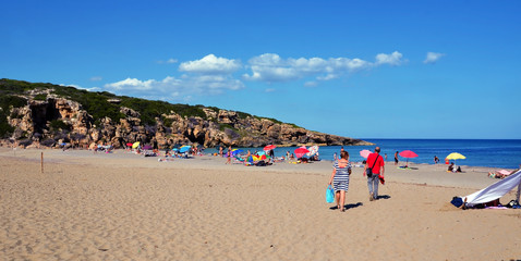 tourists on the beach (cala mosche) in one of the most beautiful beaches of Sicily, in the...