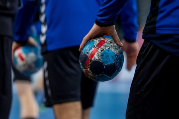 Player holding the ball for handball - obrazy, fototapety, plakaty
