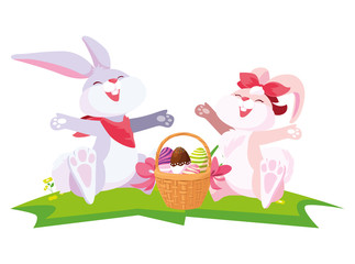 cute rabbits couple with eggs painted in basket