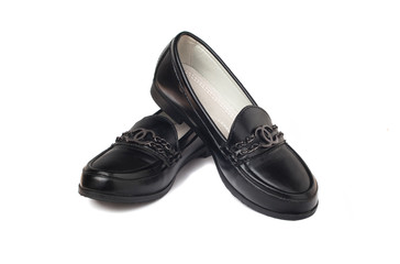 Black leather shoes on white background