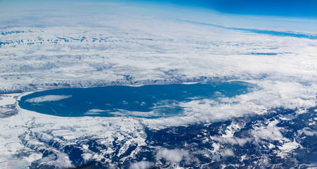 Naklejka na ściany i meble aerial view to great salt lake near salt lake city in Utah in snow