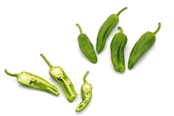 chilli pod - set of fresh whole and chopped fresh green chili peppers - isolated on white