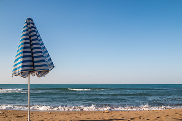 Beach umbrella and a sea © yassmin