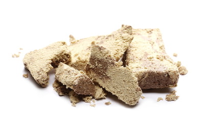 Sweet halva with chocolate on white background