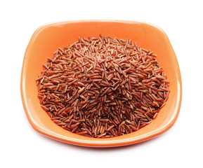 Fototapeta na wymiar Red wild rice pile in porcelain bowl isolated on white background