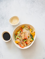 Rice noodles with vegetables, chicken meat and sesame