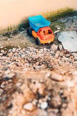 Fototapeta na wymiar Toy truck and pile of gravel