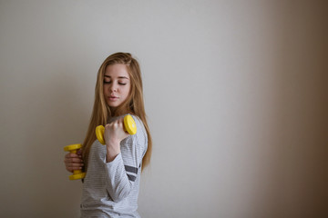 student doing exercises with dumbbells,home sports